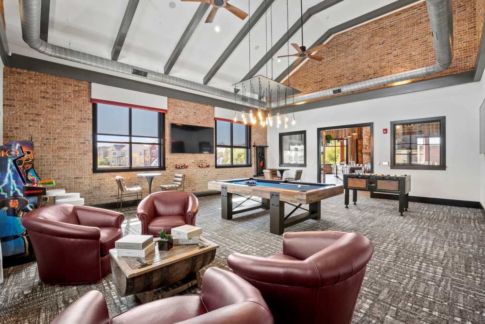 Resident lounge with a pool table at Upper East in Frederick, Maryland