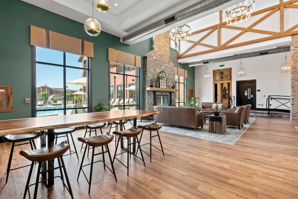 Community lounge with large windows at Upper East in Frederick, Maryland