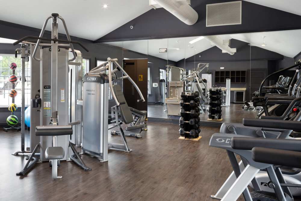 Spacious community gym with weight machines at The Gramercy in Manhattan, Kansas