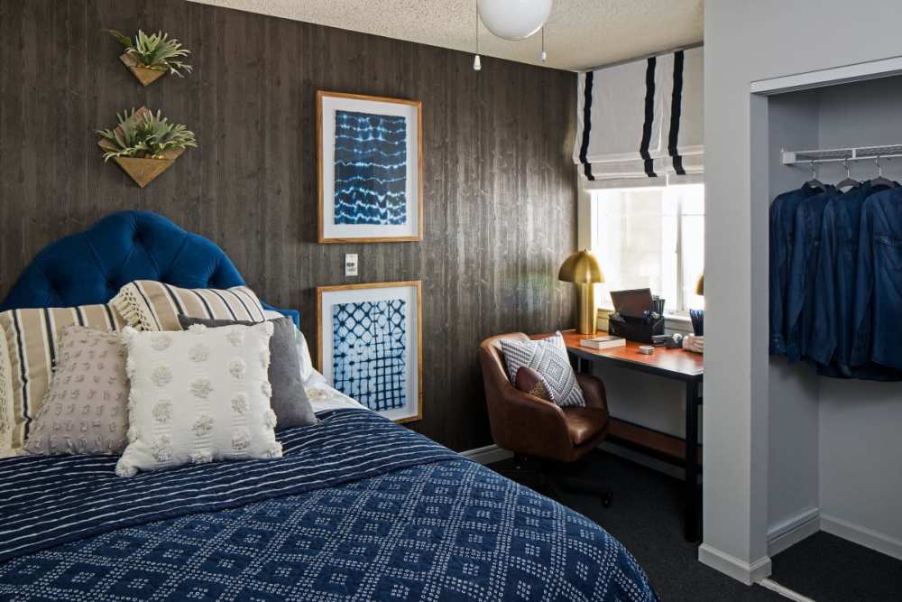 Modern apartment bedroom with closet at The Gramercy in Manhattan, Kansas