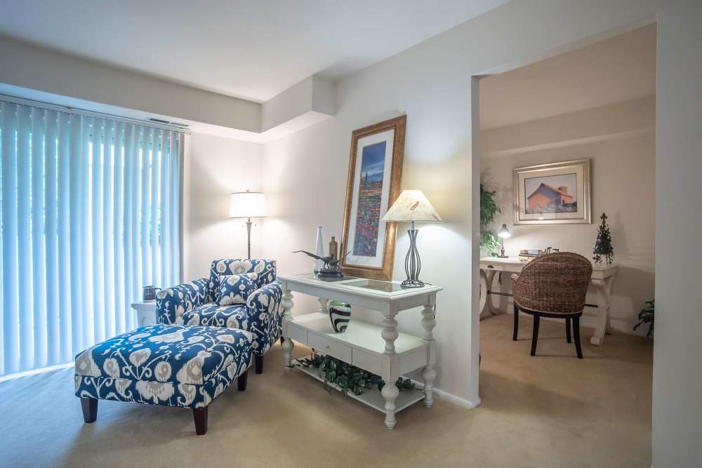 Living room with a large window at Hunt Club Apartments in Cockeysville, Maryland