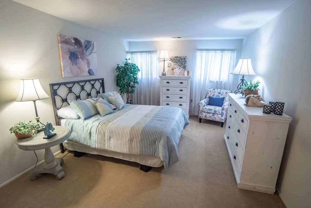 Master bedroom with a dresser at Hunt Club Apartments in Cockeysville, Maryland