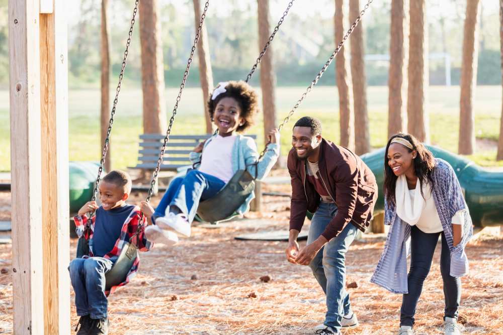 Resident family enjoying a playground near Shenandoah Commons in Front Royal, Virginia