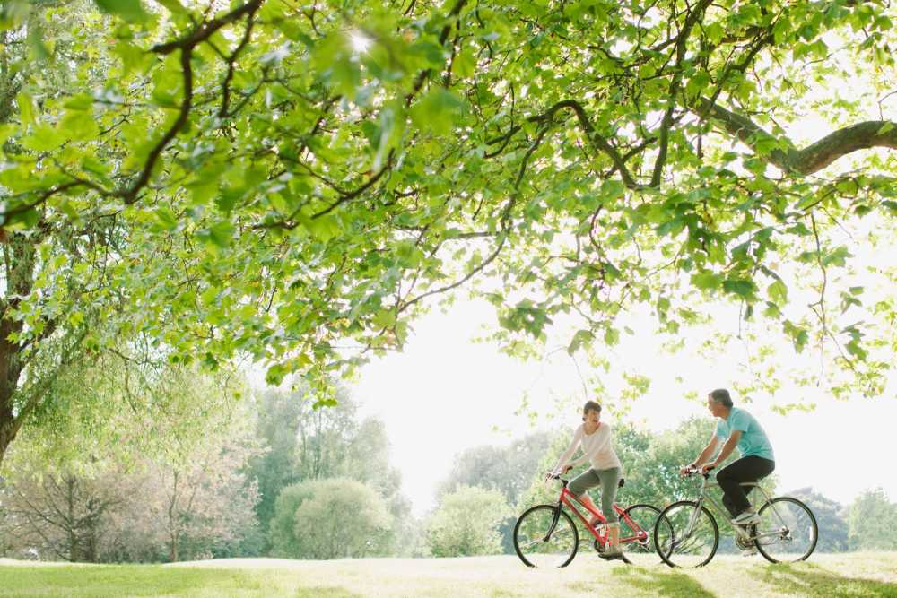 Couple biking in a park near Shenandoah Commons in Front Royal, Virginia