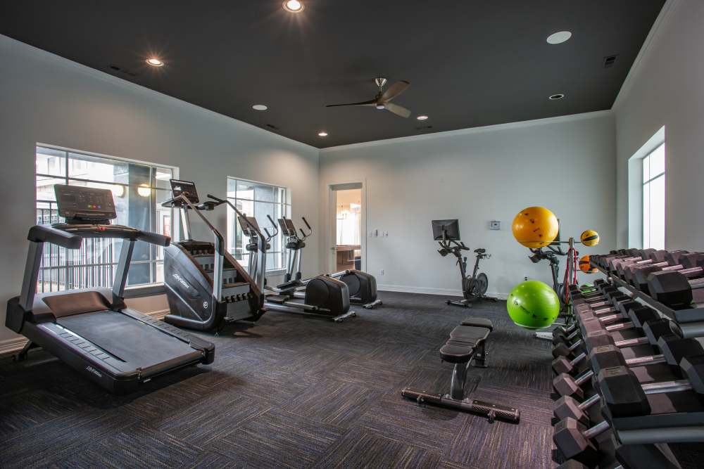 Fitness center with cardio and free weights at The Reserve on West 31st in Lawrence, Kansas