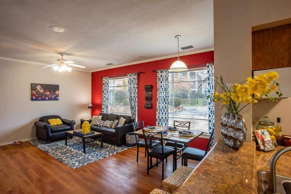 Spacious living room with hardwood floors at The Reserve on West 31st in Lawrence, Kansas