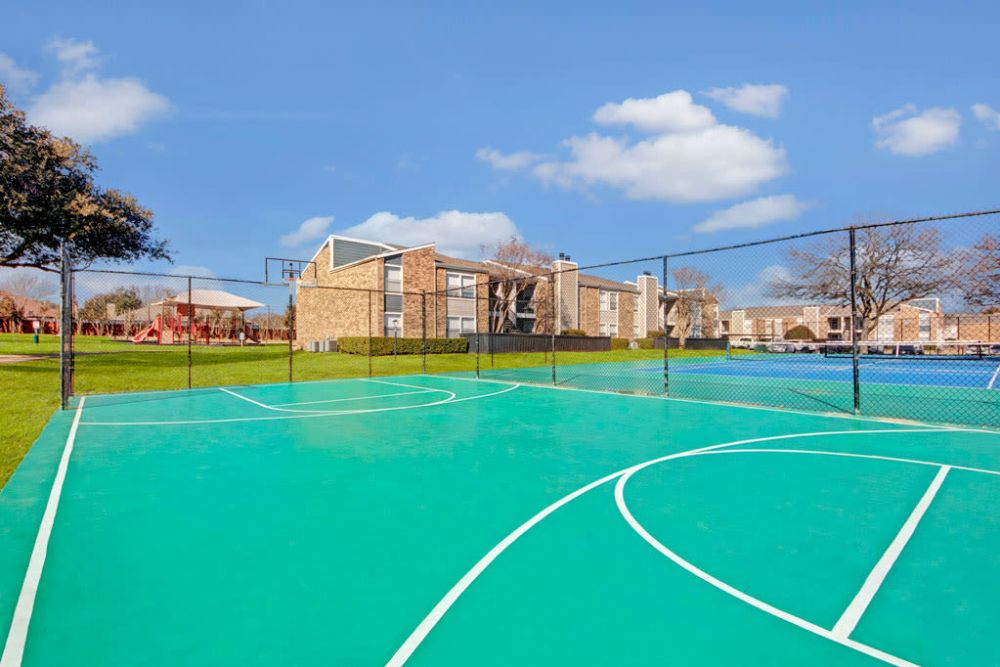 Basketball court at park at The Fairway Apartments in Plano, Texas