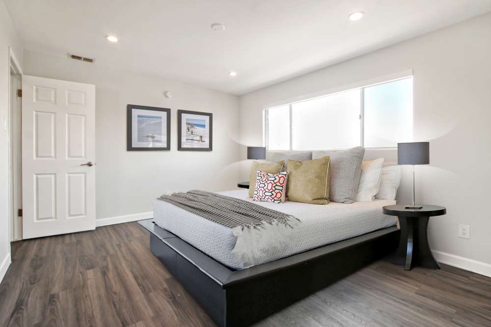 Bedroom with wood-style flooring at Casa del Rio Seco in Downey, California