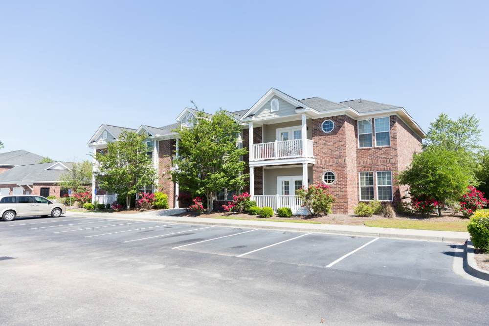 Parking spaces in front of an apartment building at Cloisters at Carolina Forest in Myrtle Beach, South Carolina