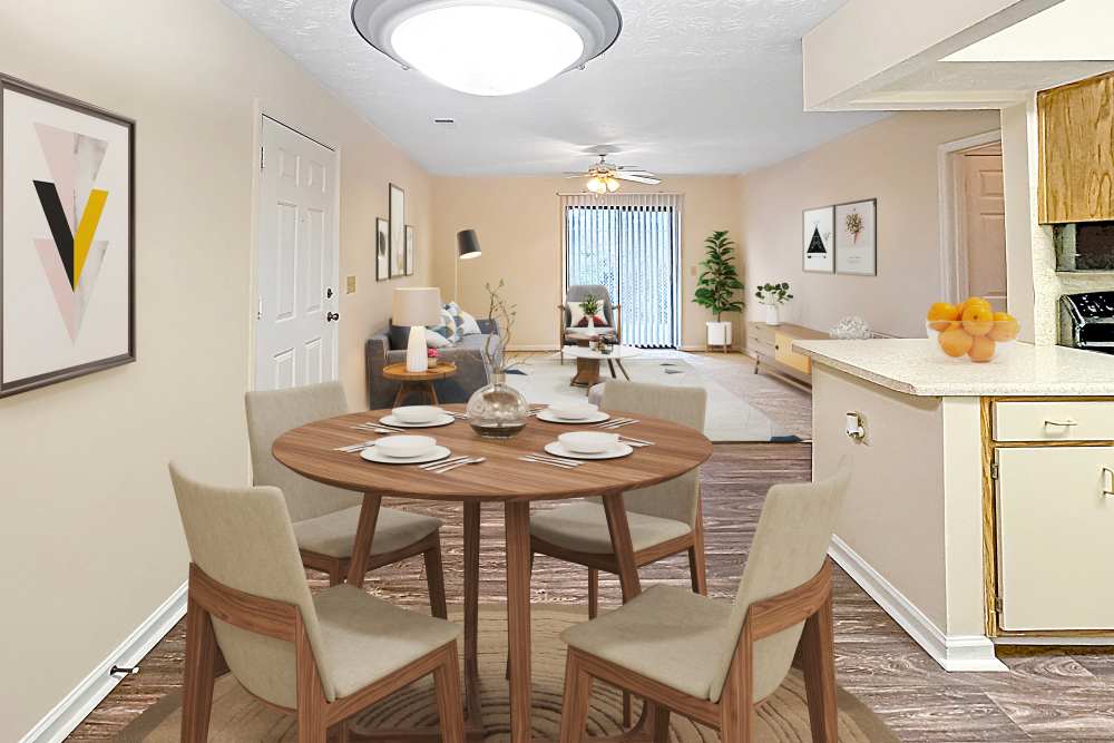 Dining room with tables, chairs and kitchen countertop at Brittwood Apartments in Columbus, Georgia