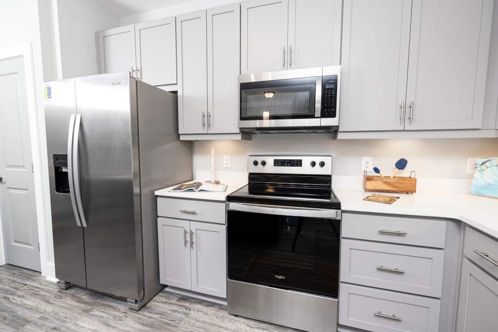 Kitchen with white cabinetry in a model home at Park Circle Village in North Charleston, South Carolina