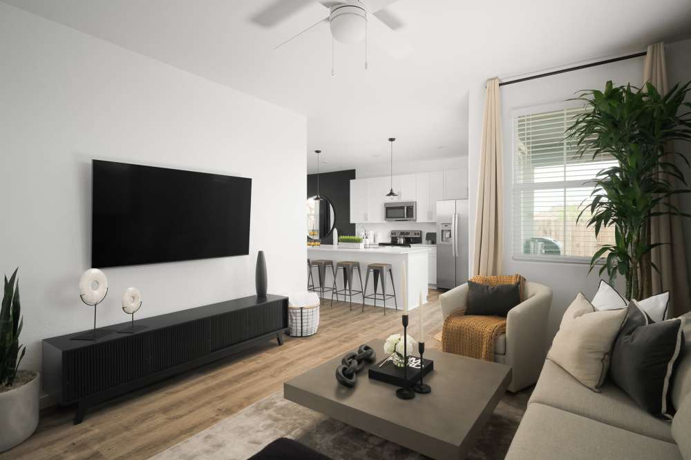 Spacious living room with a ceiling fan at Vera at Fiddyment in Roseville, California