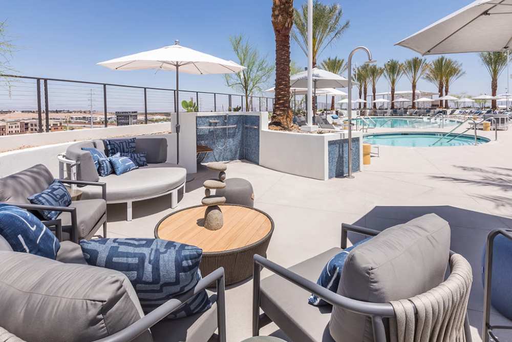 Rooftop deck community seating area beside the pool at The Ellison in Las Vegas, Nevada