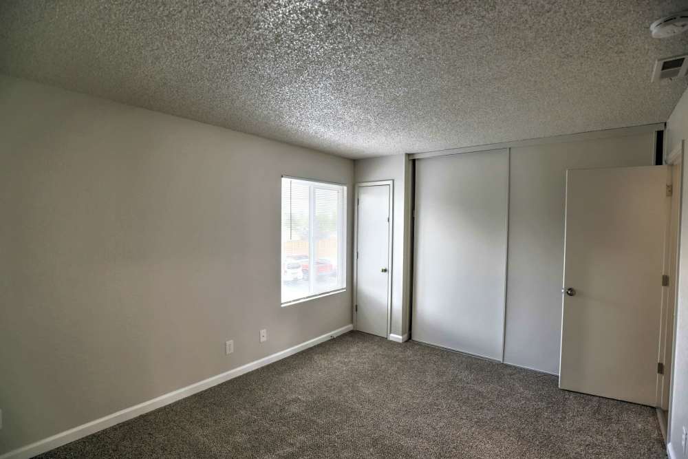 Another empty room with plus carpet flooring with thin vertical and a slider closets at Kirman Garden in Reno,Nevada