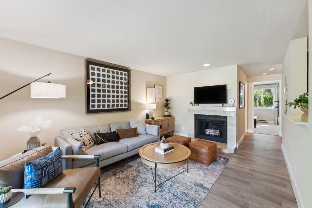 Spacious living area hardwood-style flooring at Madison Sammamish Apartments in Sammamish, Washington