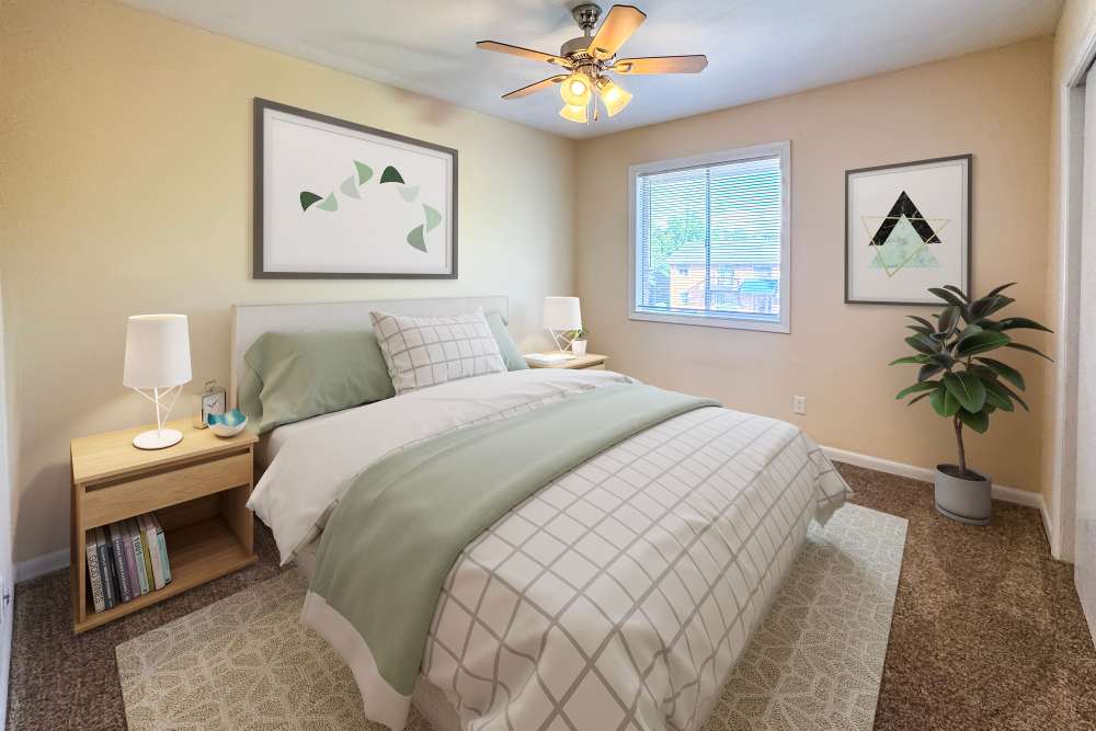 Naturally well-lit Bedroom with Ceiling Fan at Gardenbrook Apartments in Columbus, Georgia