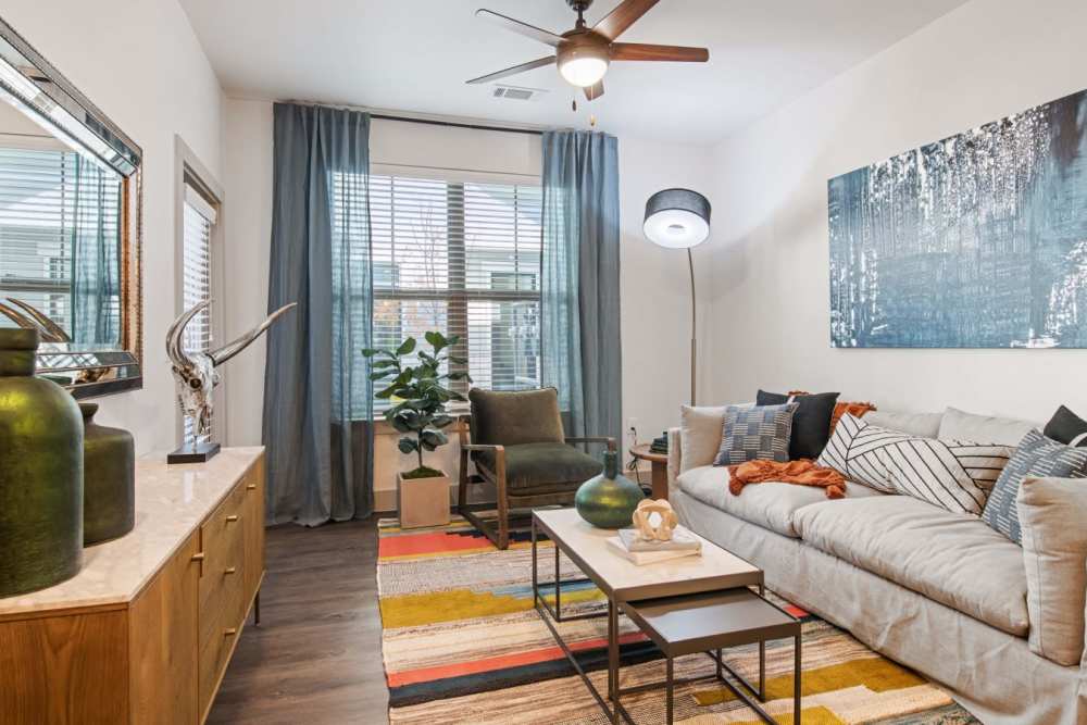 Living room with wood-style flooring at Hudson on 158 in Midland, Texas