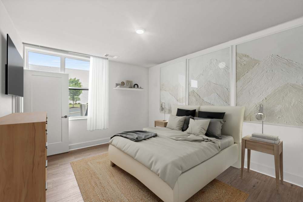 Render of a bedroom in an apartment at The Elysian at Stonefield in Charlottesville, Virginia