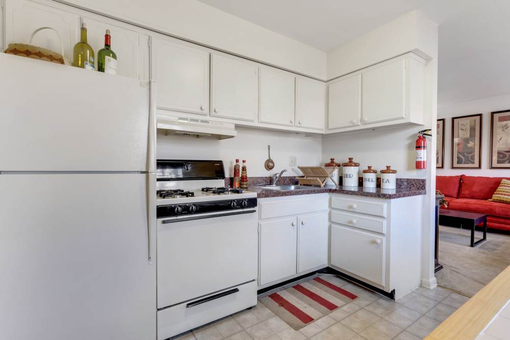 Model kitchen with white cabinets and appliances at Congress Apartment Homes in Allentown, Pennsylvania