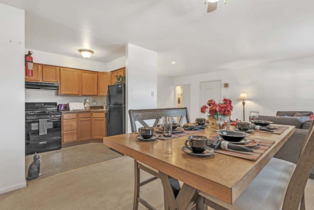 Four seating dining table next to the fully equipped kitchen at South Mountain Apartment Homes in Allentown, Pennsylvania