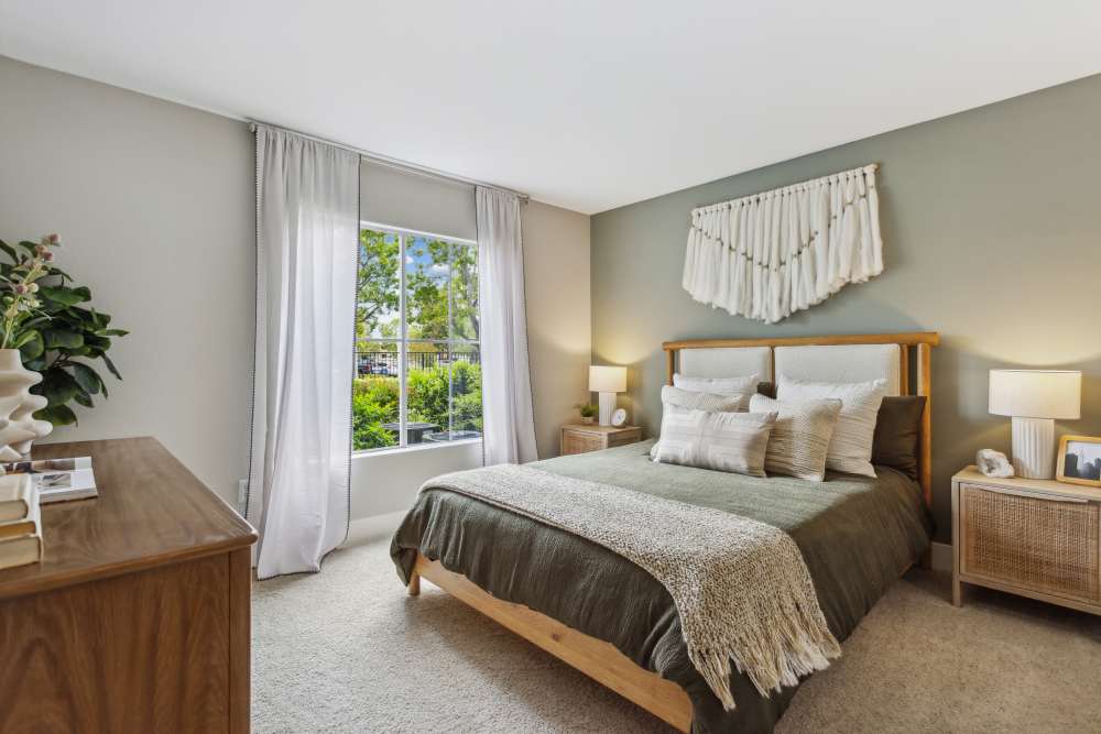 Warm and cozy bedroom with a large window and natural light at Avery at Moorpark in Moorpark, California