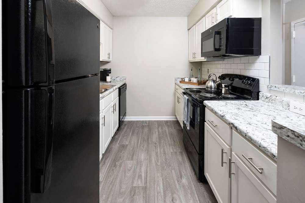 Kitchen with modern stainless-steel appliances at Cross Creek in Columbus, Georgia