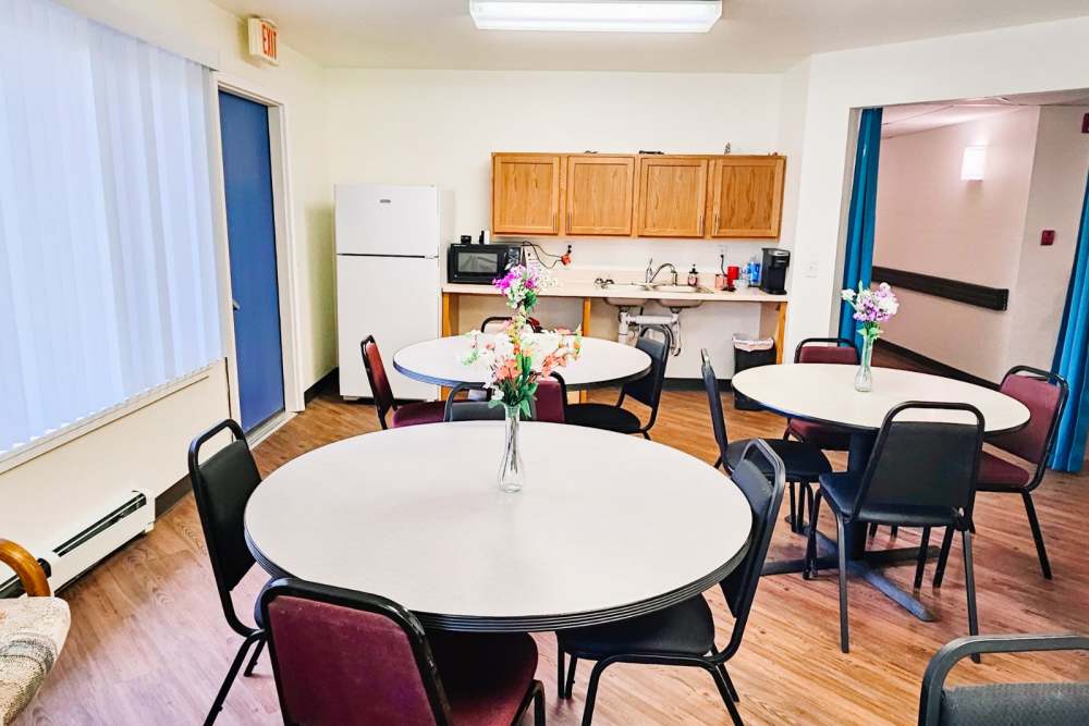 Community kitchen area for entertaining and tables at Bramblewood in New Haven, Michigan