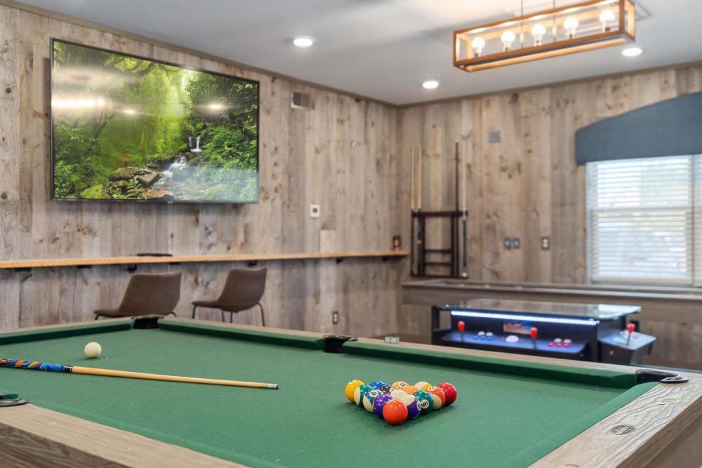 Community clubhouse with a pool table at East of Market in Frederick, Maryland