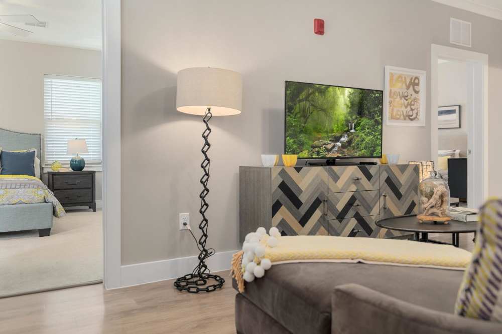 Model living room with hardwood floors at East of Market in Frederick, Maryland