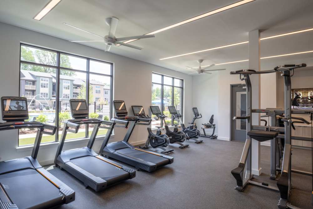 Resident fitness center with ellipticals and stationary bikes at Elms at the Refuge in Laurel, Maryland