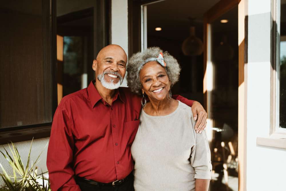 Resident couple smiling outside at Ashley Park in Charleston, South Carolina