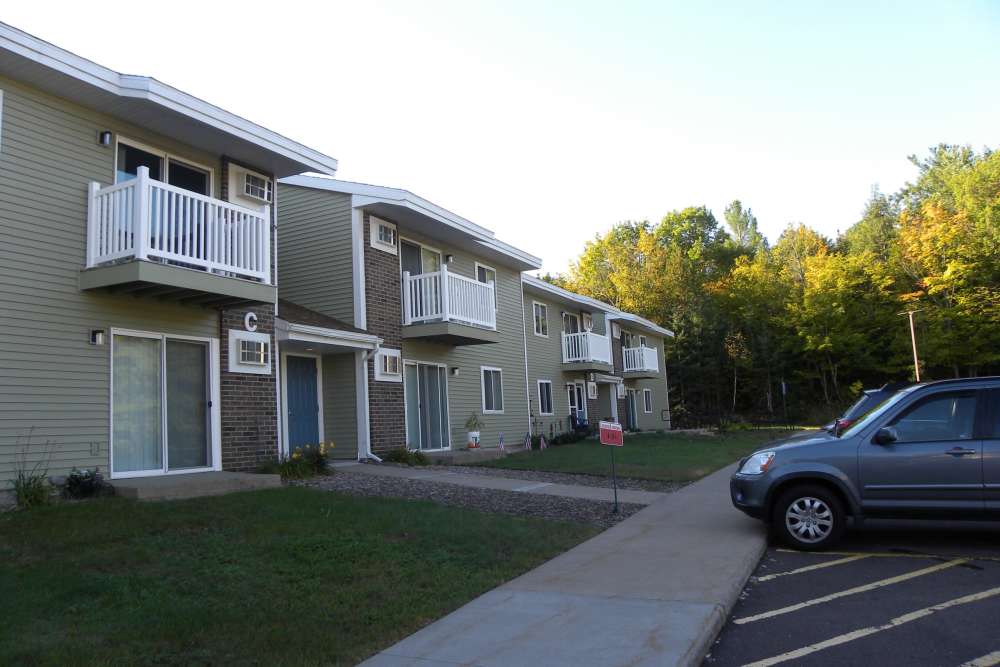 Lots of parking in the welcoming neighborhood at Copper Hills Apartments in Houghton, Michigan,