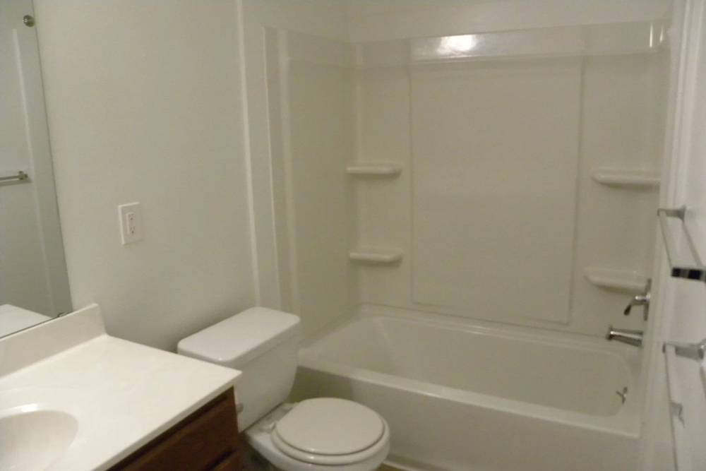 Bathroom with shower and tub at Copper Hills Apartments in Houghton, Michigan,