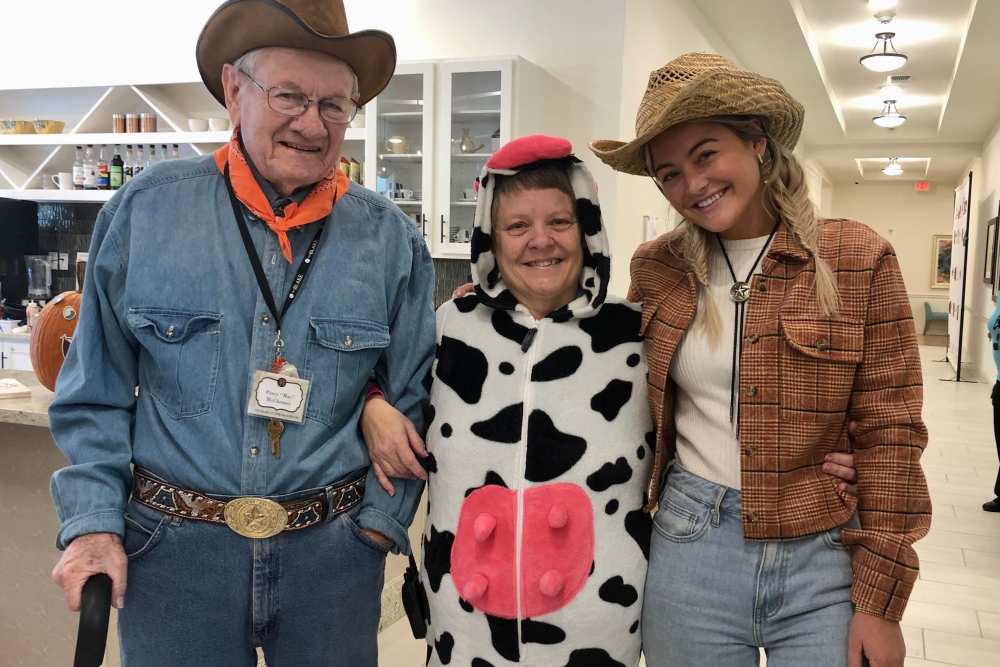 Residents dressed as cowfolk for the costume party at Deepwood Estates in Lexington, South Carolina