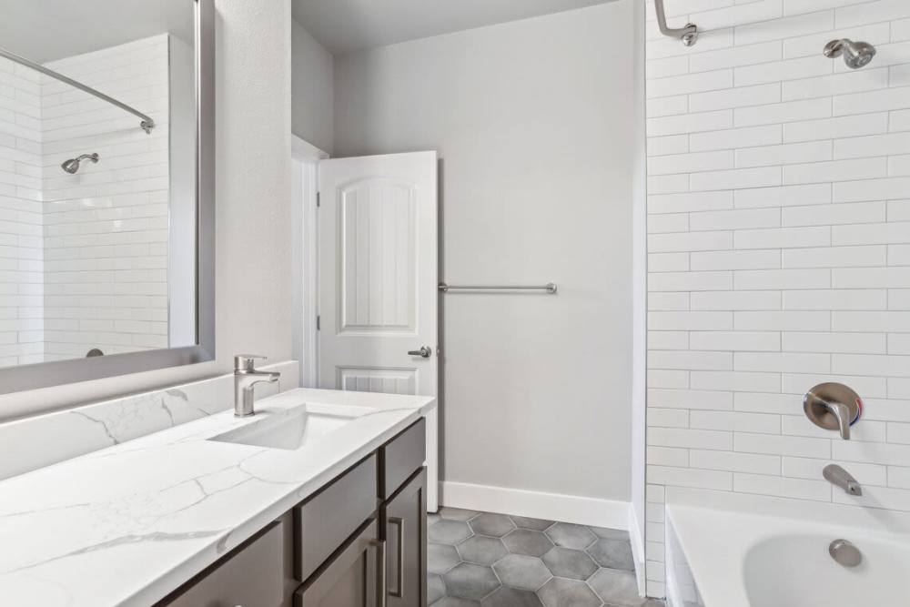 Kitchen with an island and great natural light at The Apartments at Brayden in Fort Mill, South Carolina