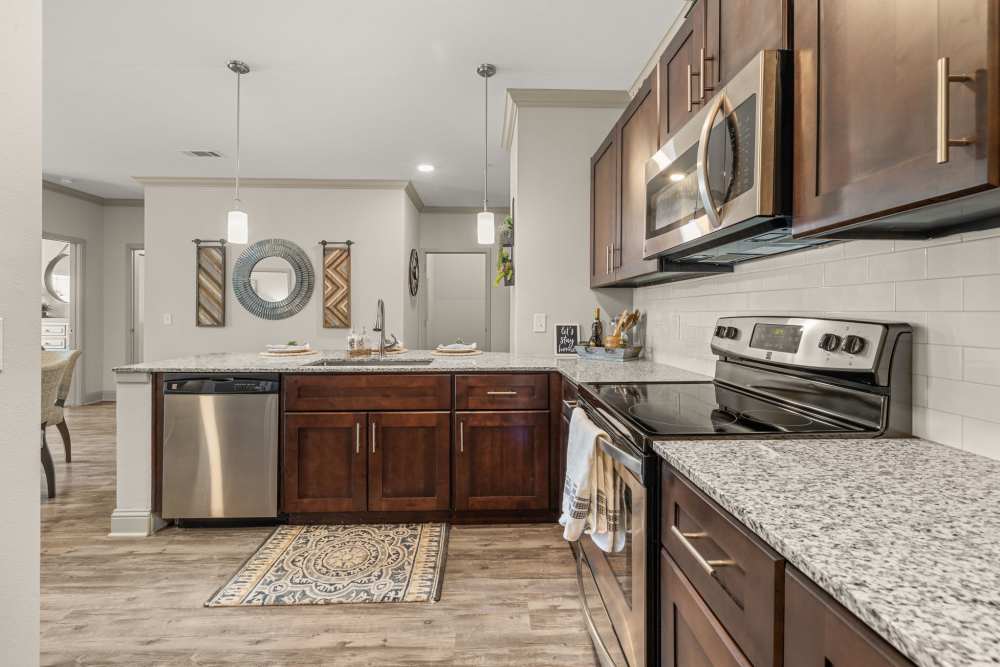 Kitchen with top of the line equipment in  Caliber at Hyland Village in Westminster, Colorado