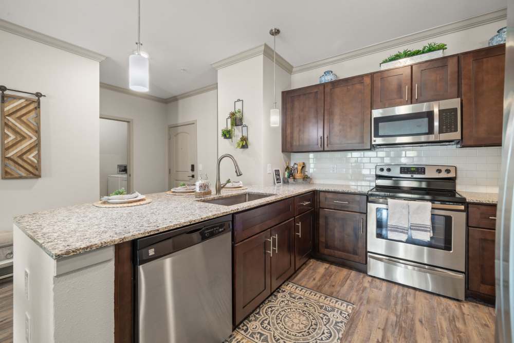 Clean kitchen in  Caliber at Hyland Village in Westminster, Colorado
