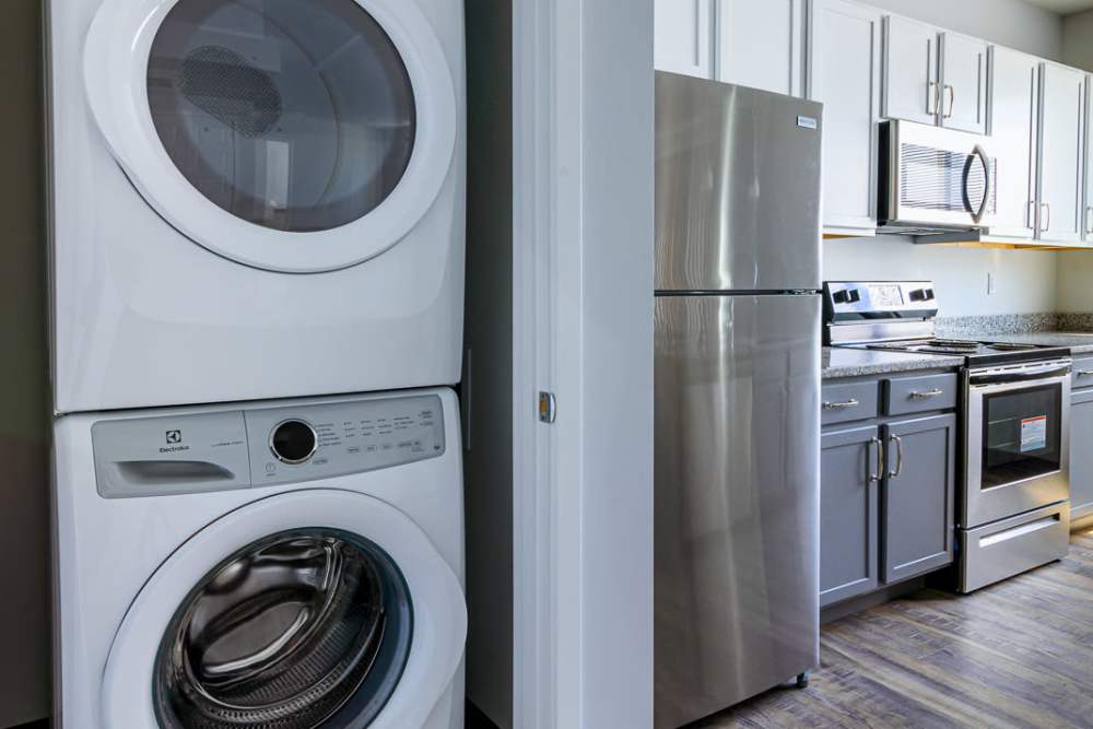 Upgraded kitchen with stainless steel appliances , washer, dryer and refrigerator at Marketplace in Flint, Michigan