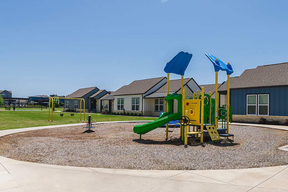 A playground in a neighborhood at parcHAUS AT CELINA PARKWAY in Celina, Texas