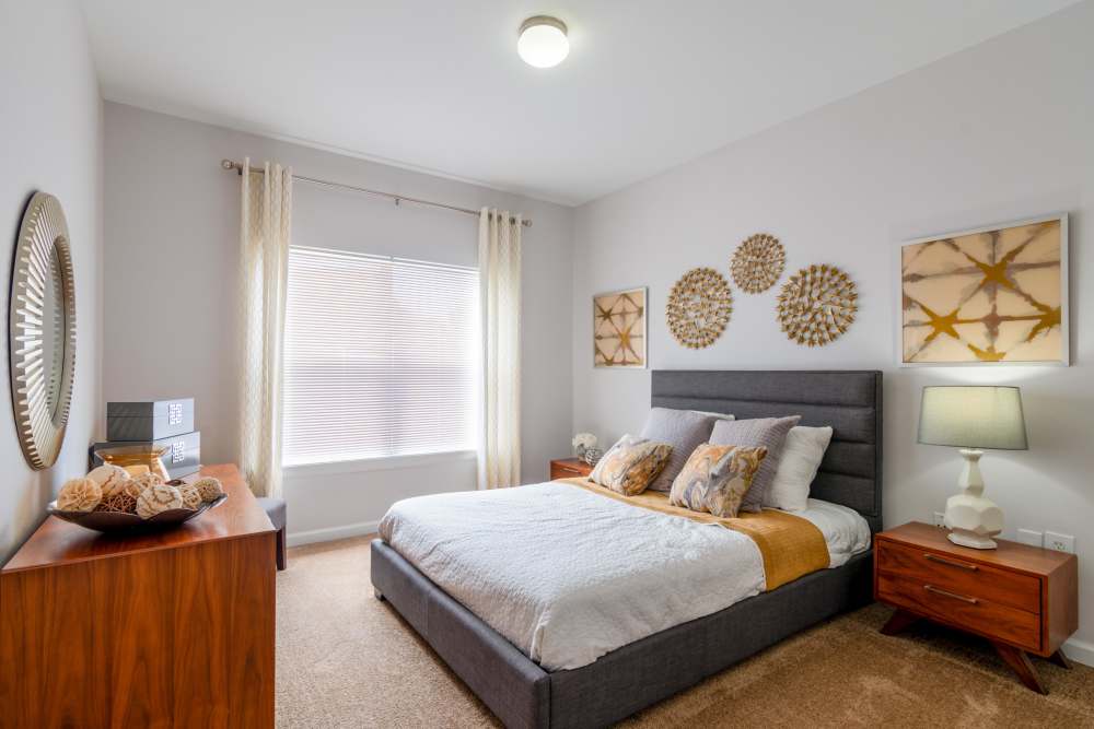 Cozy bedroom at Cornerstone Apartments in Independence, Missouri. 