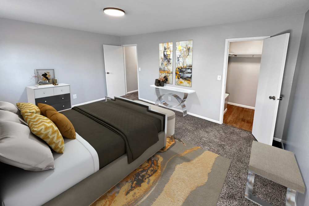 Cozy bedroom with comfortable bed at Eden Brooke Townhomes in Columbus, Ohio