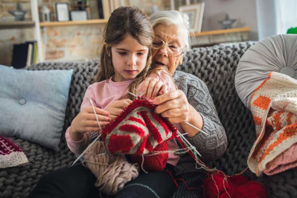 Resident with grandchild at Watermere Highlands in Arlington, Texas