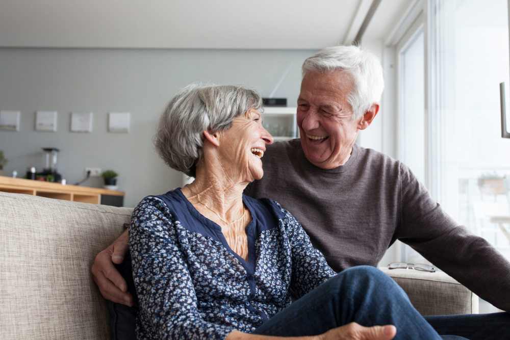 Couple smiling and laughing together at Watermere Highlands in Arlington, Texas