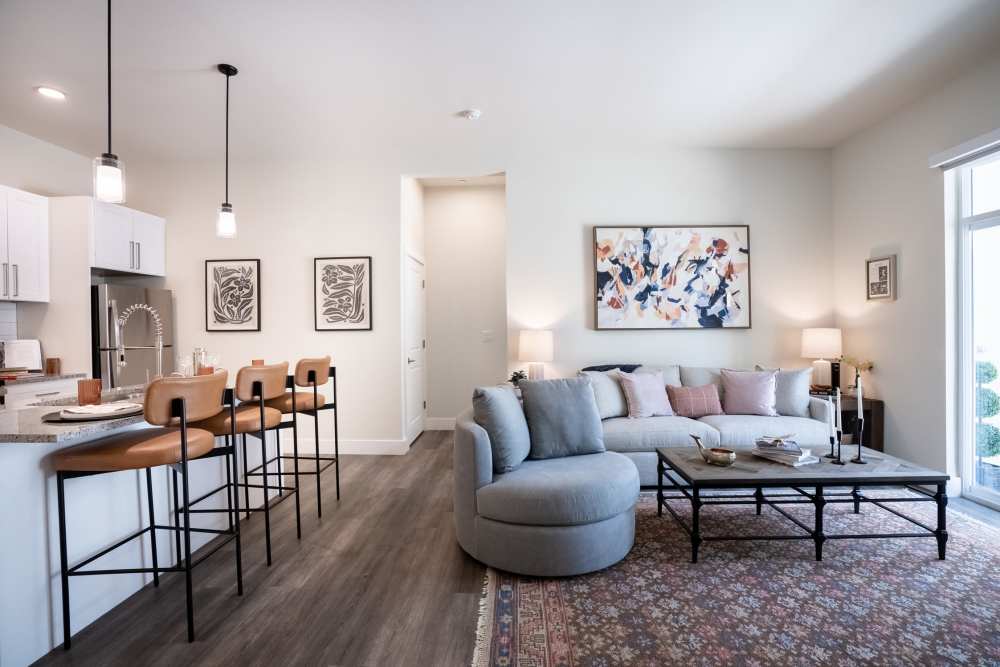 Beautiful open-concept floor plan with hardwood floors in model home at The Statler in Surprise, Arizona