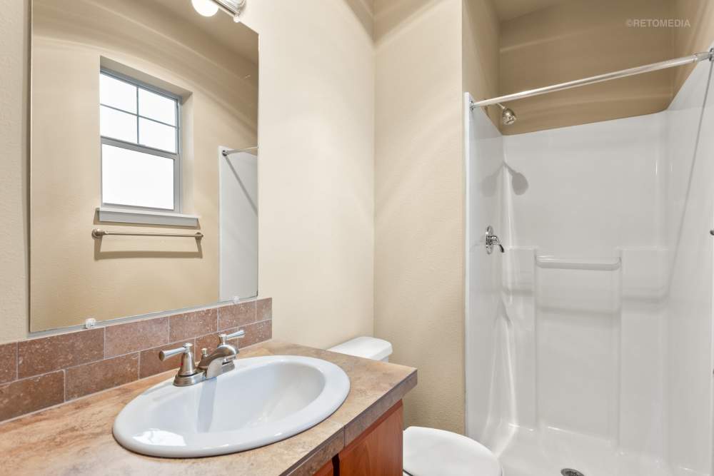 cozy bathroom with shower and sink at Orchard Ridge in Salem, Oregon