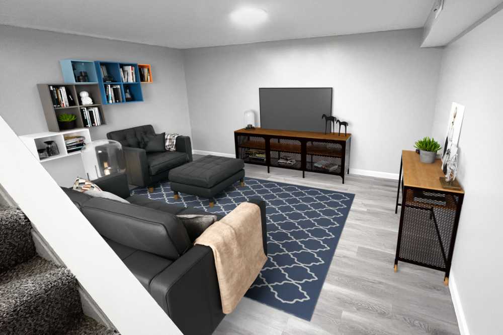 Living room with a couch and a large TV at North Eden Townhomes in Columbus, Ohio