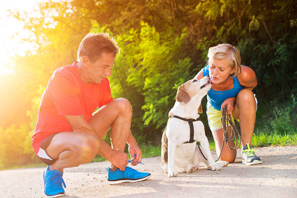 Active couple with dog at Hayloft Big Creek in Alpharetta, Georgia