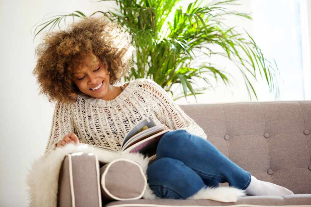 Woman reading book at Copper Square in Lancaster, California