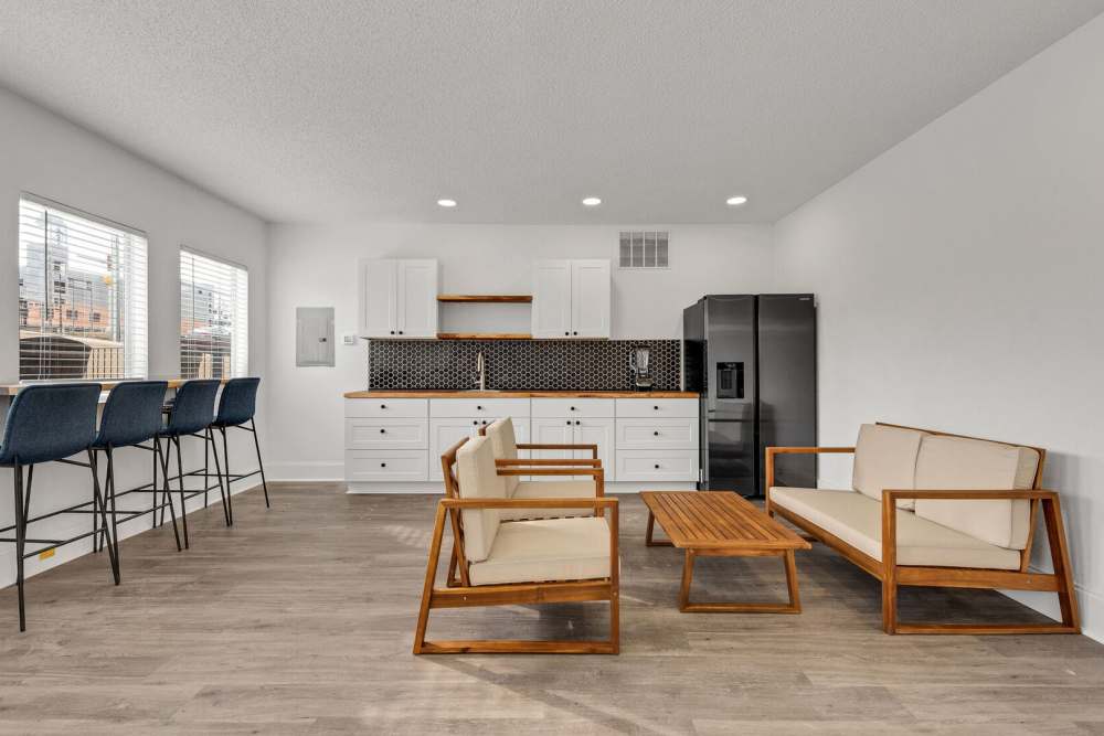 Club bouse with kitchen and seating at Vivo Living Charlotte in Charlotte, North Carolina, 