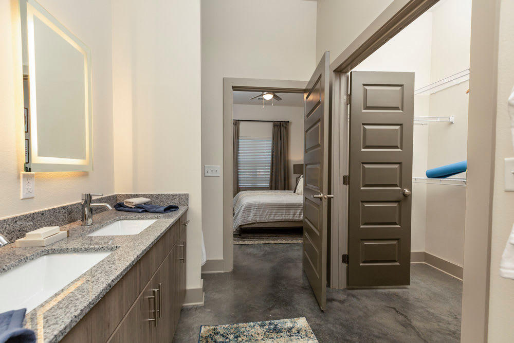 Bathroom leading to the walk-in closet and master bedroom of a model home at Beacon Station in Augusta, Georgia